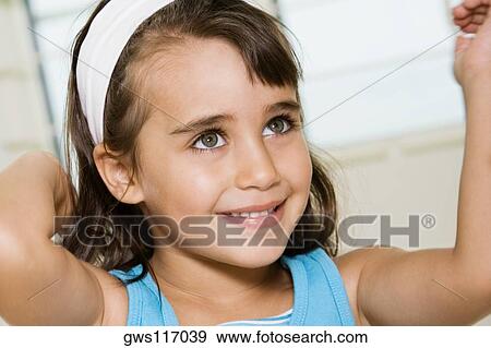 Stock Photo - Close-up of a girl smiling. Fotosearch