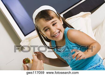 Close-up of a girl smiling View Large Photo Image Stock Photo - Close-up of a girl smiling. Fotosearch