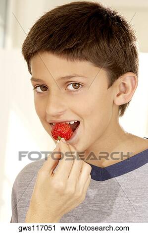 Close-up of a woman's hand feeding a boy a strawberry View Large Photo Image Stock Image - Close-up of a woman's hand feeding a boy a strawberry. Fotosearch