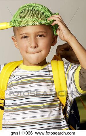 Portrait of a boy holding a fishing net over his head View Large Photo Image Stock Photograph - Portrait of a boy holding a fishing net over his head. Fotosearch