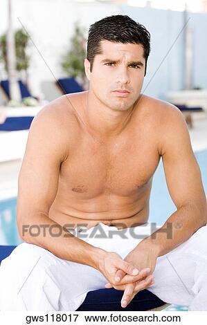 Portrait of a mid adult man sitting with his hands clasped View Large Photo Image Stock Photo - Portrait of a mid adult man sitting with his hands clasped. Fotosearch