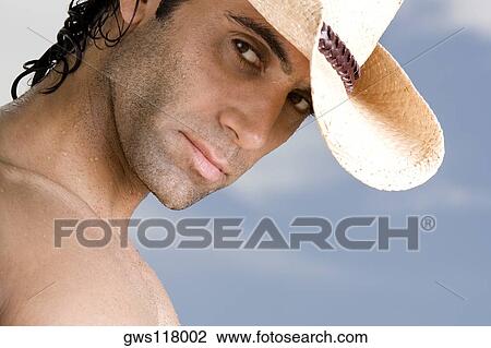 Portrait of a mid adult man wearing a hat View Large Photo Image Stock Image - Portrait of a mid adult man wearing a hat. Fotosearch
