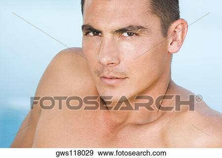 Portrait of a young man looking serious View Large Photo Image Stock Photo - Portrait of a young man looking serious. Fotosearch