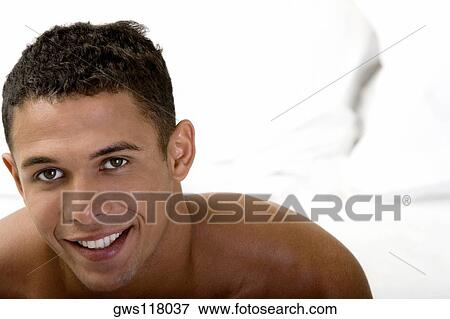 Stock Photo - Portrait of a young man smiling. Fotosearch