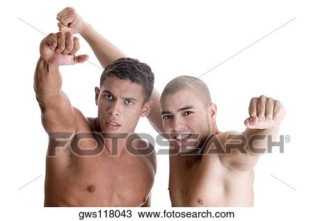 Portrait of two young men showing their fists View Large Photo Image Stock Image - Portrait of two young men showing their fists. Fotosearch
