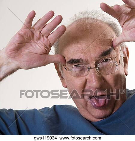 Picture - Close-up of a senior man making a face. Fotosearch