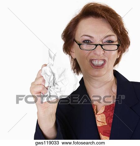Portrait of a businesswoman crushing paper View Large Photo Image Stock Image - Portrait of a businesswoman crushing paper. Fotosearch