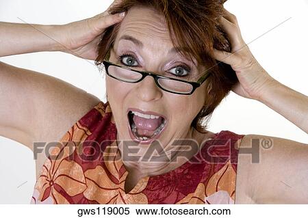 Portrait of a senior woman with her hands on her head View Large Photo Image Stock Photography - Portrait of a senior woman with her hands on her head. Fotosearch