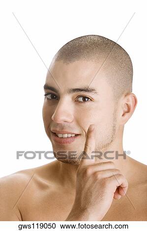 Portrait of a young man pointing View Large Photo Image Stock Image - Portrait of a young man pointing. Fotosearch