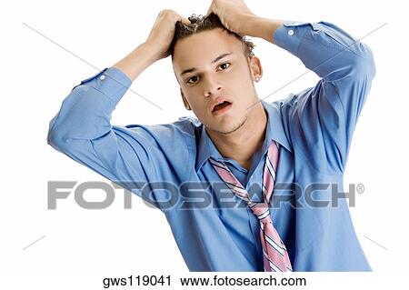 Portrait of a young man pulling his hair View Large Photo Image Stock Image - Portrait of a young man pulling his hair. Fotosearch