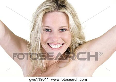 Portrait of a young woman smiling with her arms outstretched View Large Photo Image Stock Image - Portrait of a young woman smiling with her arms outstretched. Fotosearch
