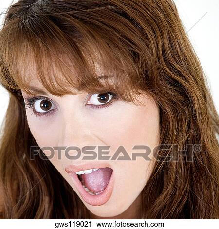Portrait of a young woman with her mouth open View Large Photo Image Stock Image - Portrait of a young woman with her mouth open. Fotosearch