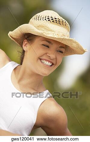 Stock Image - Close-up of a young woman smiling. Fotosearch