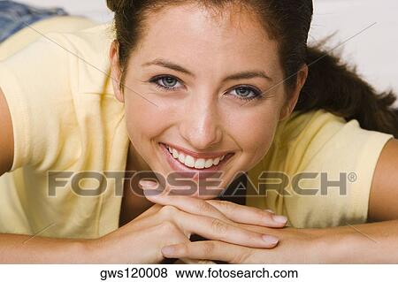 Stock Photo - Close-up of a young woman smiling. Fotosearch