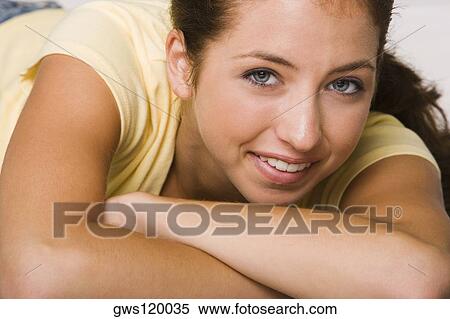 Close-up of a young woman smiling View Large Photo Image Stock Photography - Close-up of a young woman smiling. Fotosearch