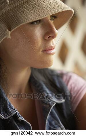 Stock Image - Close-up of a young woman thinking. Fotosearch