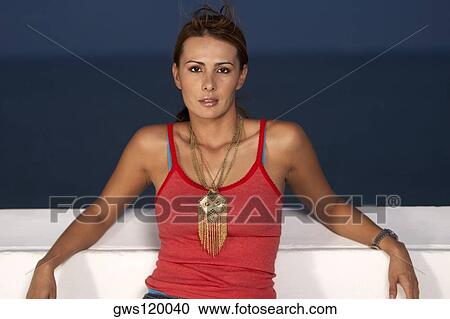 Portrait of a mid adult woman leaning over a wall View Large Photo Image Stock Image - Portrait of a mid adult woman leaning over a wall. Fotosearch
