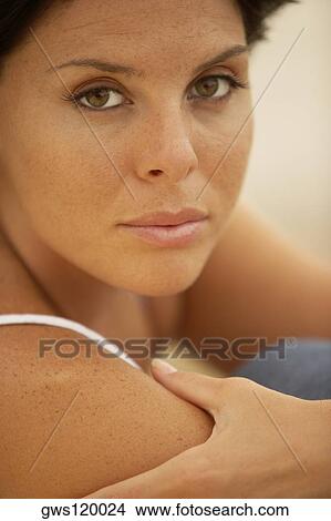 Picture - Portrait of a young woman looking serious. Fotosearch