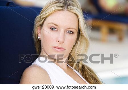 Portrait of a young woman looking serious View Large Photo Image Stock Photo - Portrait of a young woman looking serious. Fotosearch