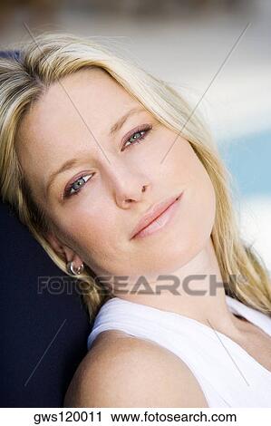 Portrait of a young woman smiling View Large Photo Image Stock Image - Portrait of a young woman smiling. Fotosearch