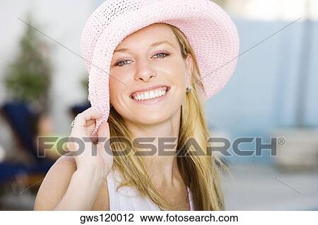 Portrait of a young woman smiling View Large Photo Image Stock Image - Portrait of a young woman smiling. Fotosearch