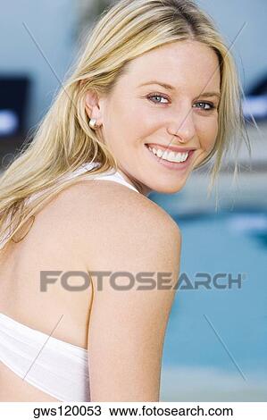 Stock Image - Portrait of a young woman smiling. Fotosearch