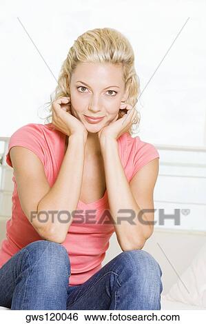 Portrait of a young woman smiling View Large Photo Image Stock Photograph - Portrait of a young woman smiling. Fotosearch