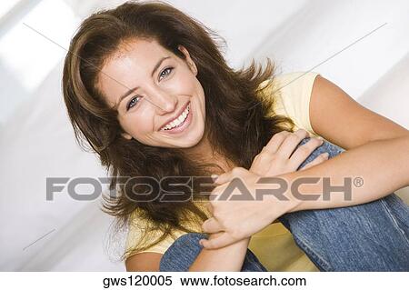 Stock Photography - Portrait of a young woman smiling. Fotosearch