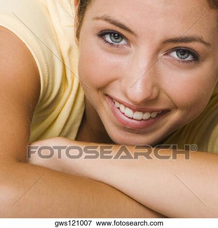 Stock Photo - Close-up of a young woman smiling. Fotosearch