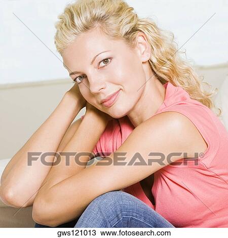 Portrait of a young woman smiling View Large Photo Image Stock Image - Portrait of a young woman smiling. Fotosearch
