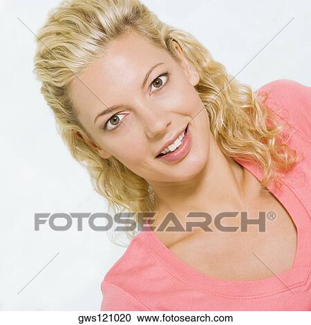 Stock Image - Portrait of a young woman smiling. Fotosearch