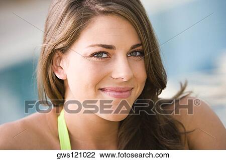 Portrait of a young woman smiling View Large Photo Image Stock Image - Portrait of a young woman smiling. Fotosearch