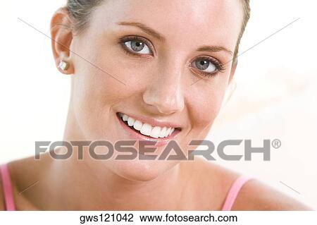 Portrait of a young woman smiling View Large Photo Image Stock Image - Portrait of a young woman smiling. Fotosearch