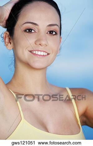 Portrait of a young woman smiling View Large Photo Image Stock Image - Portrait of a young woman smiling. Fotosearch