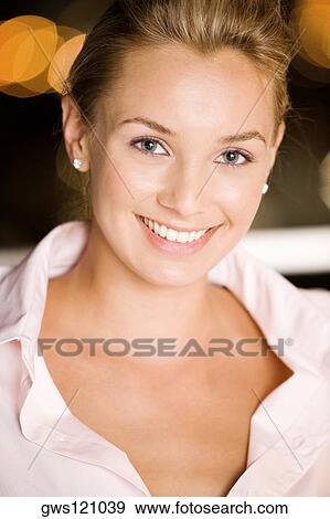 Portrait of a young woman smiling View Large Photo Image Stock Photo - Portrait of a young woman smiling. Fotosearch