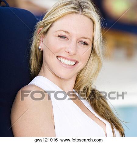 Portrait of a young woman smiling View Large Photo Image Stock Photograph - Portrait of a young woman smiling. Fotosearch