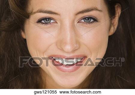 Portrait of a young woman smiling View Large Photo Image Stock Photography - Portrait of a young woman smiling. Fotosearch