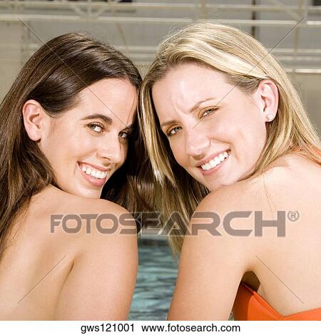 Portrait of two young women smiling View Large Photo Image Stock Image - Portrait of two young women smiling. Fotosearch