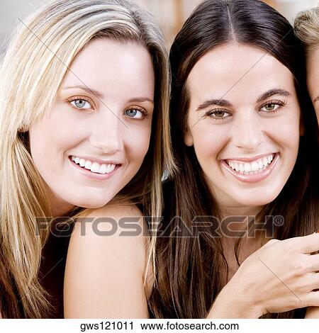 Portrait of two young women smiling View Large Photo Image Stock Image - Portrait of two young women smiling. Fotosearch