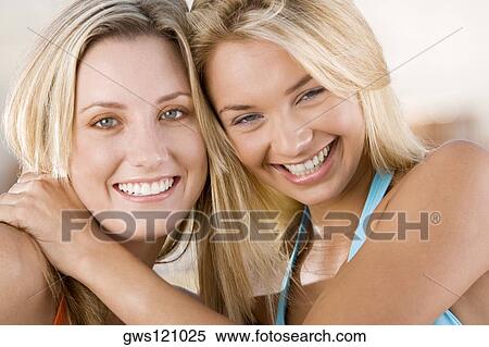 Portrait of two young women smiling View Large Photo Image Stock Photography - Portrait of two young women smiling. Fotosearch