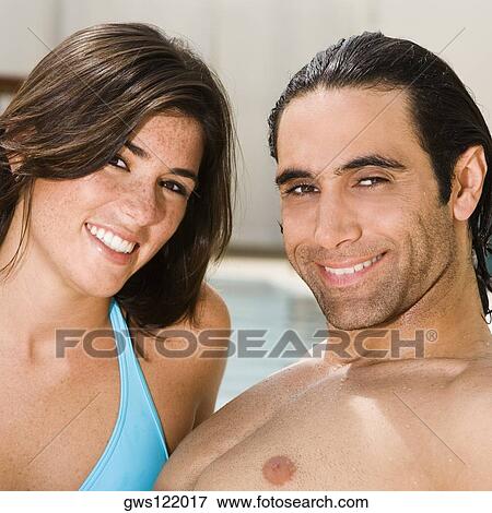 Portrait of a mid adult man and a young woman smiling View Large Photo Image Stock Photo - Portrait of a mid adult man and a young woman smiling. Fotosearch