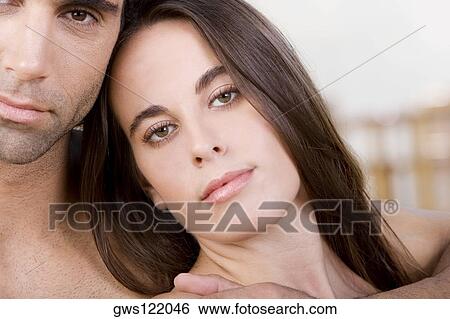 Portrait of a mid adult man and a young woman View Large Photo Image Stock Photograph - Portrait of a mid adult man and a young woman. Fotosearch