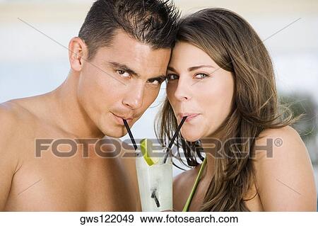 Portrait of a young couple drinking lemonade View Large Photo Image Stock Photo - Portrait of a young couple drinking lemonade. Fotosearch