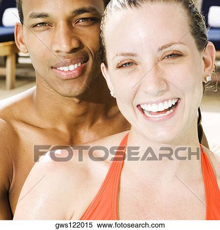 Portrait of a young couple smiling View Large Photo Image Stock Photography - Portrait of a young couple smiling. Fotosearch