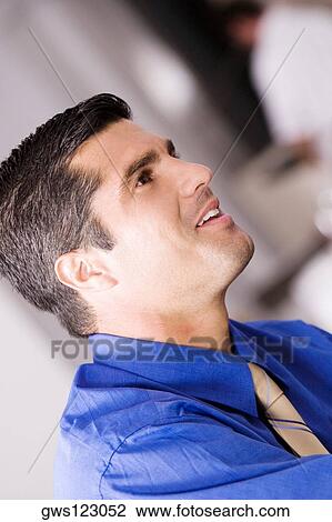 Close-up of a businessman smiling View Large Photo Image Stock Image - Close-up of a businessman smiling. Fotosearch