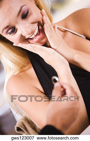 Stock Photo - Close-up of a man giving an engagement ring to a young woman. Fotosearch