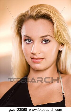 Portrait of a young woman smiling View Large Photo Image Stock Photo - Portrait of a young woman smiling. Fotosearch