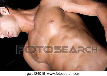 Stock Photography - Low angle view of a mid adult man with his eyes closed. Fotosearch