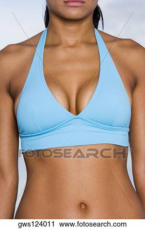 Stock Image - Mid section view of a young woman. Fotosearch