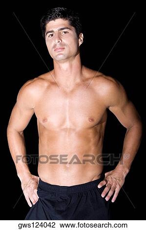 Portrait of a mid adult man standing with his hands on his waist View Large Photo Image Stock Image - Portrait of a mid adult man standing with his hands on his waist. Fotosearch